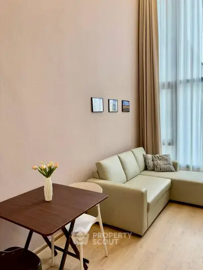 Modern living room with high ceiling and elegant decor