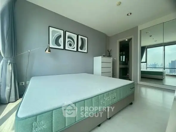 Spacious bedroom with modern decor and city view