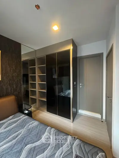 Modern bedroom with sleek wardrobe and stylish decor
