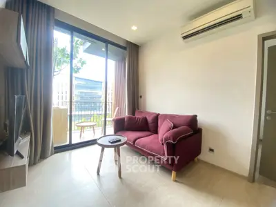 Modern living room with balcony view and stylish furniture