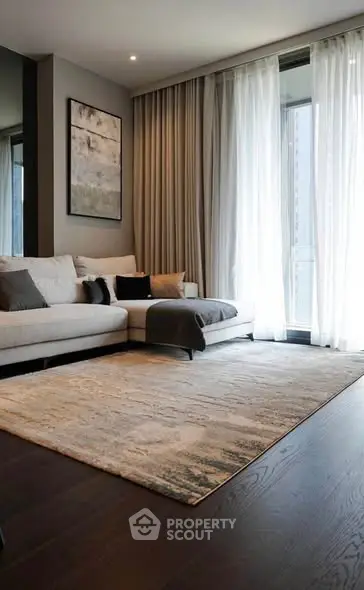 Modern living room with elegant decor and large window