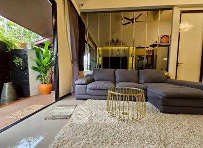 Luxurious living room with modern decor and spacious balcony access