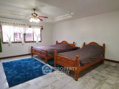 Spacious bedroom with twin beds and elegant decor