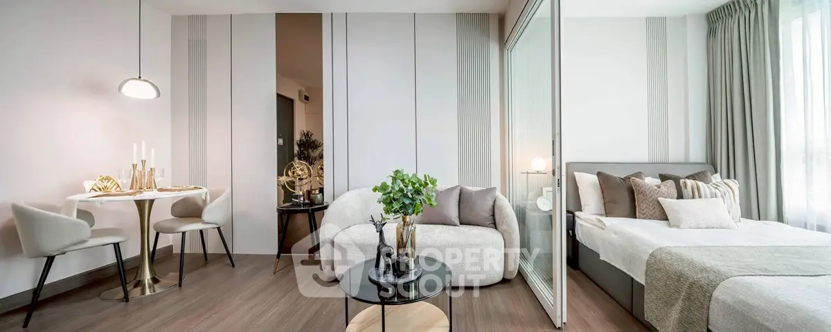 Modern studio apartment with stylish decor and cozy bedroom area