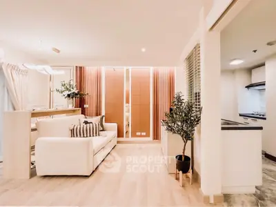 Modern living room with stylish decor and open kitchen layout