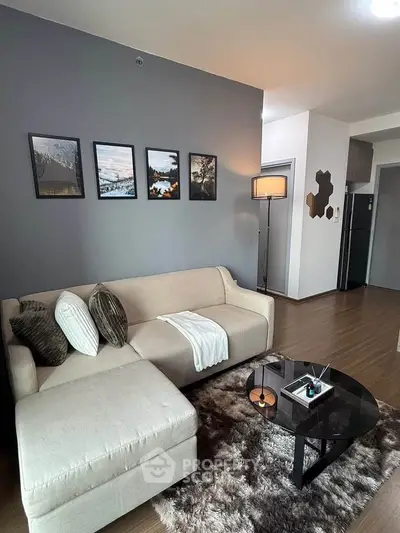 Modern living room with stylish decor, cozy sofa, and elegant coffee table in a contemporary apartment.