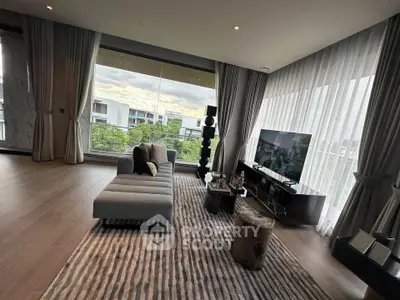 Luxurious living room with panoramic window and modern decor in upscale apartment.