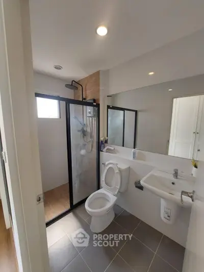 Modern bathroom with glass shower and sleek fixtures