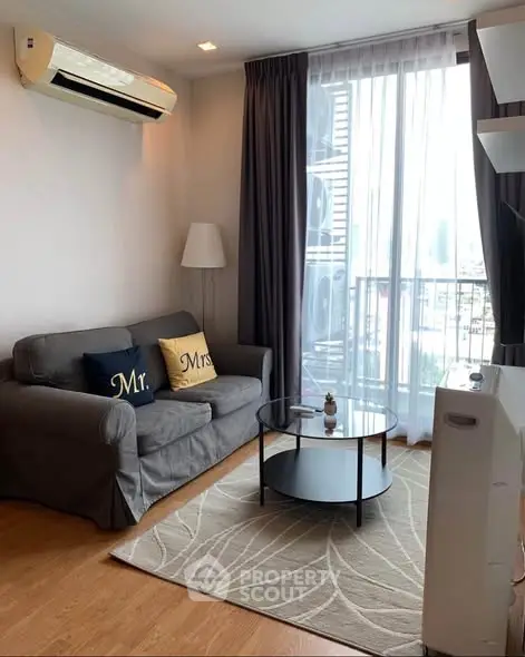 Cozy living room with modern decor and large window view