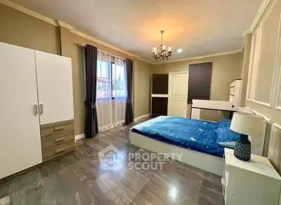 Spacious bedroom with elegant decor and natural light