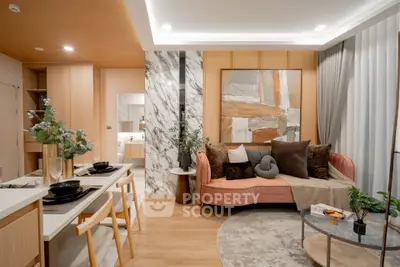 Stylish modern living room with elegant decor and open dining area, featuring contemporary furniture and artistic accents.