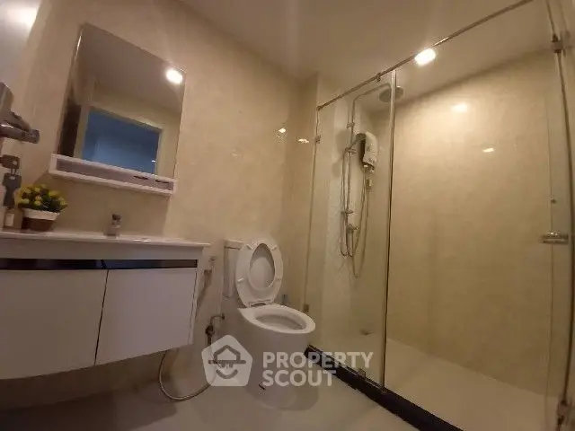 Modern bathroom with glass shower and sleek fixtures