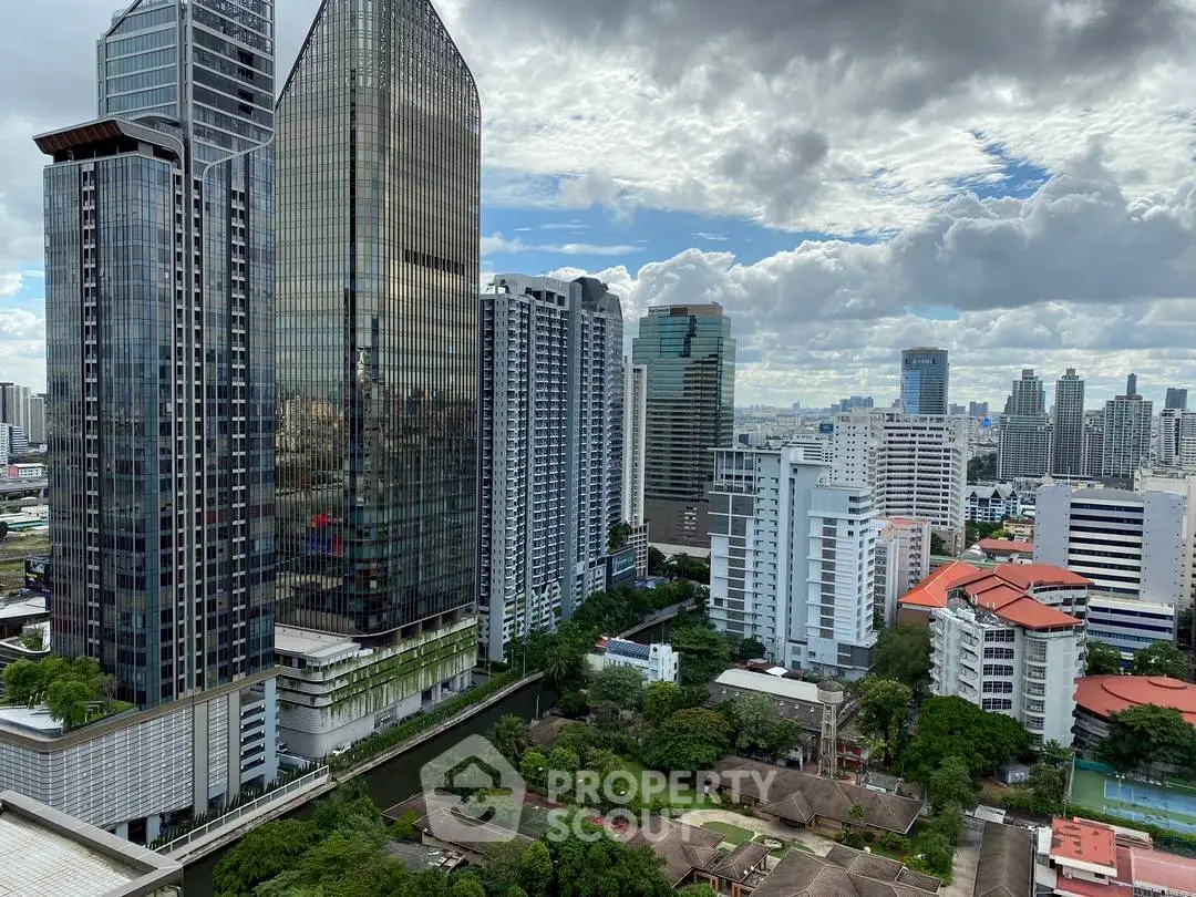 Stunning cityscape view showcasing modern skyscrapers and lush greenery.