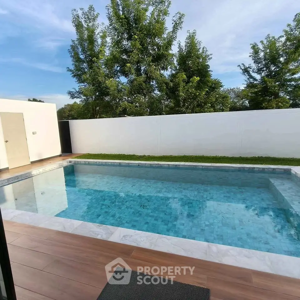 Luxurious private pool with serene surroundings and modern design.