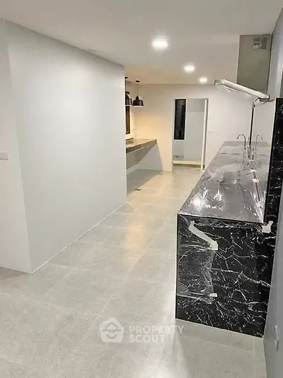 Modern kitchen with sleek marble countertops and open layout design