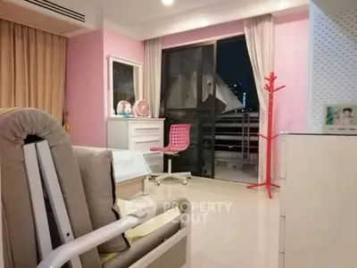 Charming bedroom with balcony access and modern decor in urban apartment.