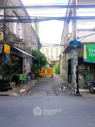 Urban alleyway with residential buildings and street view