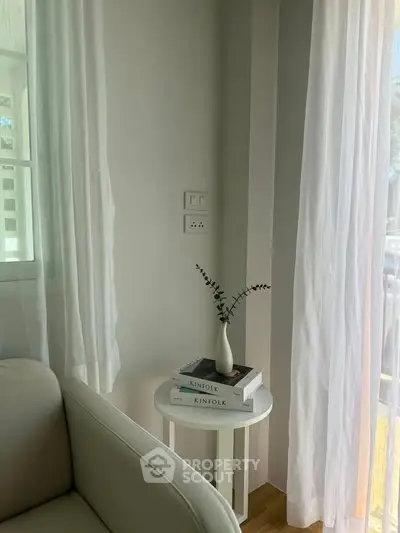 Cozy living room corner with natural light and minimalist decor