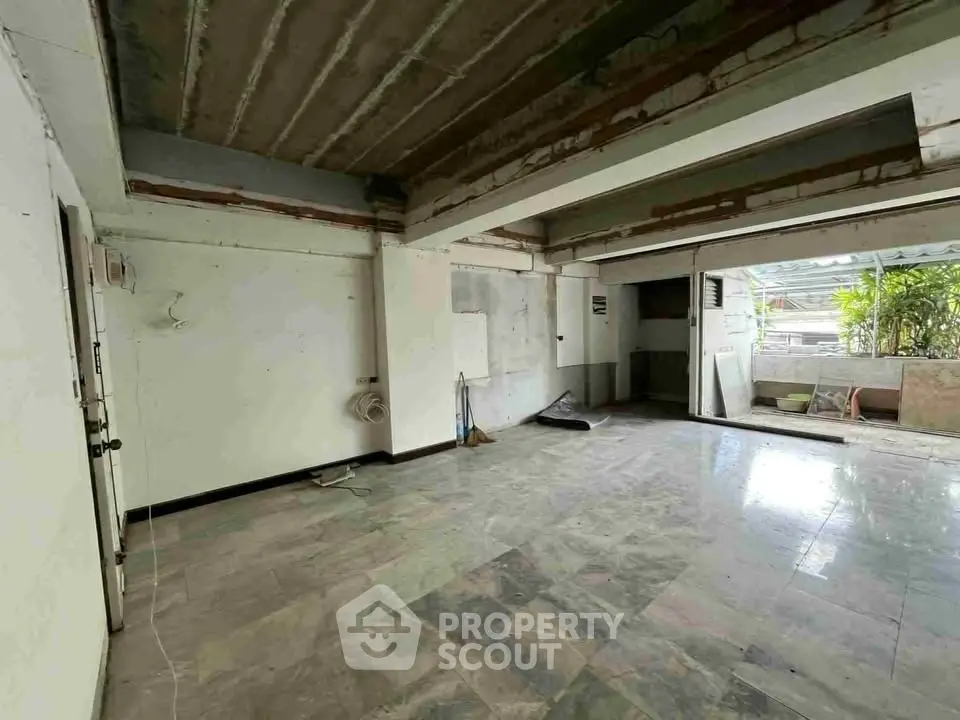 Spacious open-plan interior with potential for customization and natural light.