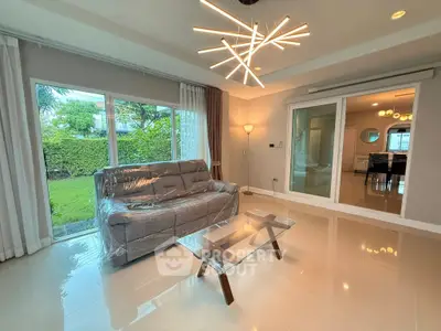Modern living room with stylish lighting and garden view