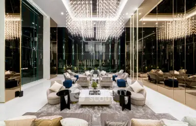Luxurious modern living room with elegant chandeliers and plush seating