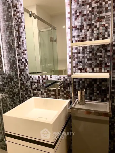 Modern bathroom with stylish mosaic tiles and sleek fixtures