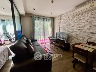 Chic living room with modern decor and balcony view, perfect for urban living.