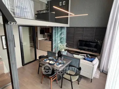 Modern duplex living room with stylish dining area and open kitchen layout