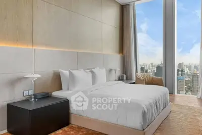 Luxurious bedroom with stunning city view and modern decor