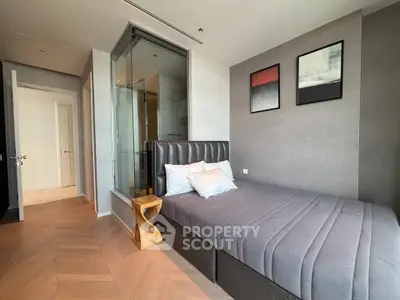 Modern bedroom with stylish decor and glass partition in luxury apartment