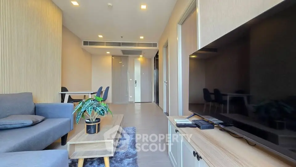 Modern living room with sleek furniture and open layout, perfect for urban living.