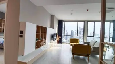 Spacious modern living room with city view and stylish furniture