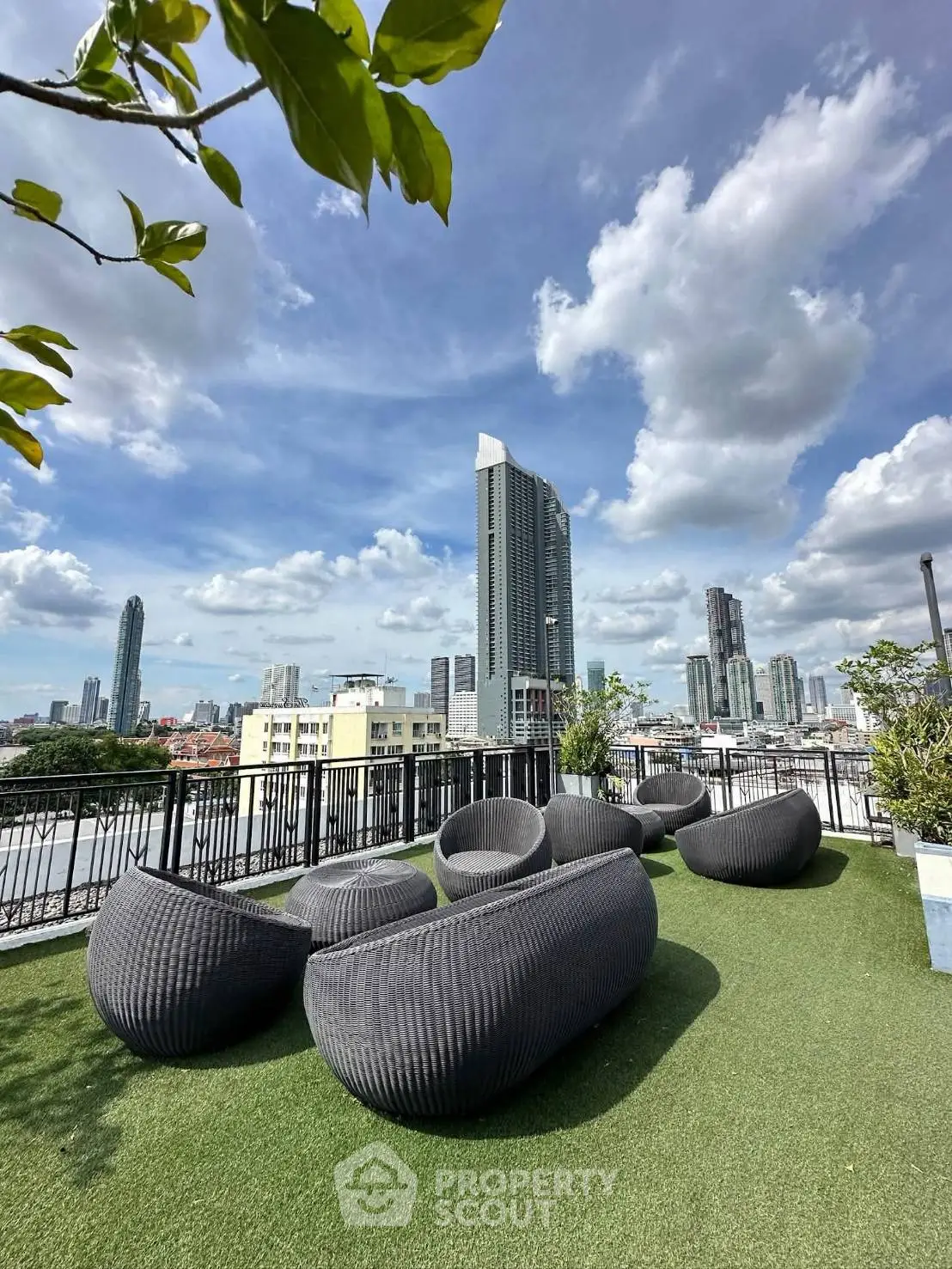 Stunning rooftop terrace with modern seating and panoramic city views, perfect for relaxation and entertainment.