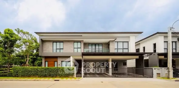 Modern two-story house with sleek design and spacious driveway