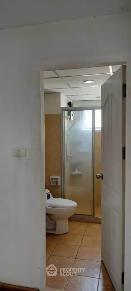 Compact bathroom with shower and toilet in a real estate property