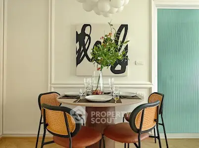 Stylish dining area with modern decor and elegant table setting in a cozy apartment.