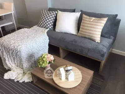 Cozy living room with stylish sofa and decorative pillows