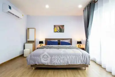 Spacious and modern bedroom with elegant decor and natural light