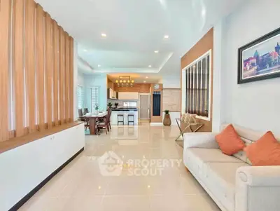 Spacious modern living room with open kitchen and elegant decor