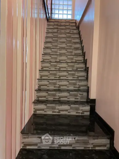 Elegant staircase with modern tile design in a stylish home interior