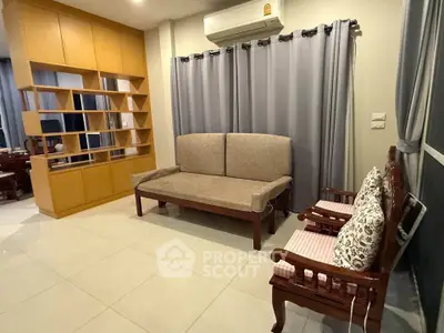 Spacious living room with elegant wooden furniture and modern shelving unit