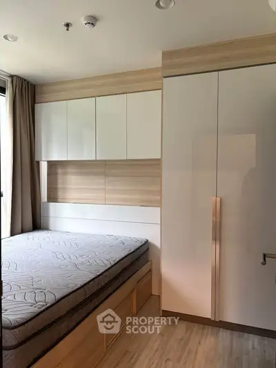 Modern bedroom with built-in storage and natural light