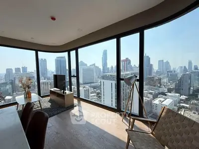 Stunning corner unit living room with panoramic city views and modern decor.