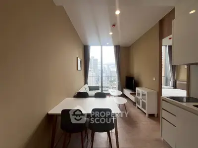 Modern living room with city view, stylish furniture, and natural light.