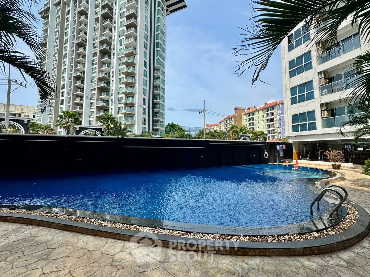 Luxurious apartment complex with stunning pool and modern architecture