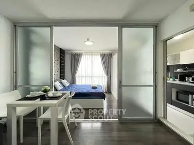 Modern studio apartment with sliding glass doors and stylish decor