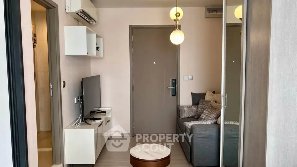 Modern living room with stylish decor and cozy seating area, perfect for relaxation.