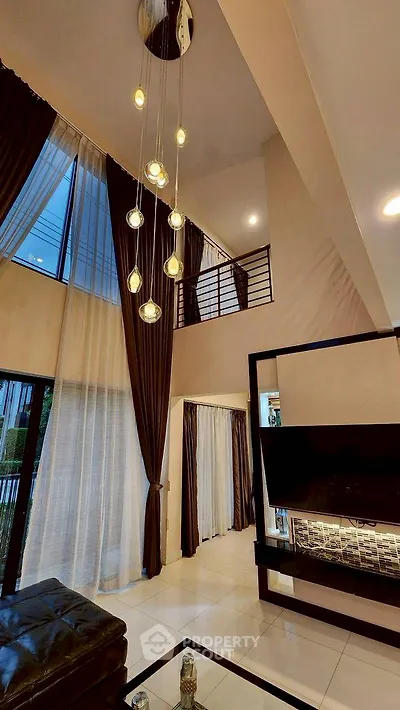 Luxurious modern living room with high ceilings and elegant lighting