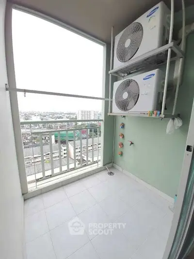 Spacious balcony with city view and air conditioning units, perfect for relaxation.