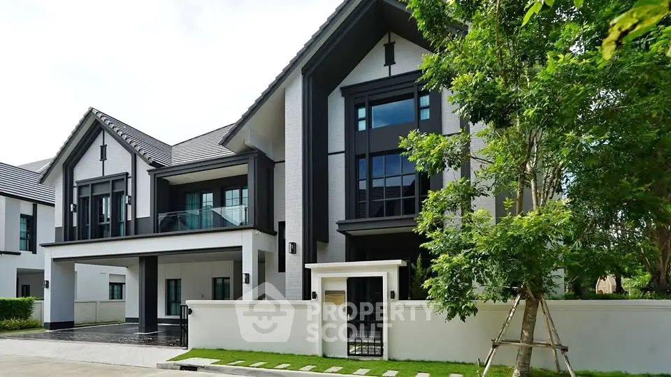 Luxurious modern house exterior with sleek design and lush greenery, perfect for upscale living.